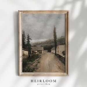 May include: A vintage oil painting depicting a rural scene with a dirt road leading through a small village. The houses are white with brown roofs, and there are trees and hills in the background. The sky is a muted gray, and the overall tone of the painting is peaceful and serene.