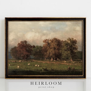 May include: A framed vintage landscape painting featuring a pastoral scene with trees, sheep, and a dirt path. The artwork has a dark wooden frame with gold trim. The painting's color palette includes greens, browns, and blues.