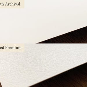May include: A side-by-side comparison of two types of paper. The top section displays smooth, white paper labeled "Smooth Archival." The bottom section shows textured, off-white paper labeled "Textured Premium." Both papers are on a dark wood surface.