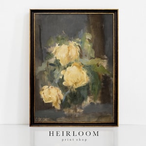 Op de afbeelding: Een olieverfschilderij van gele rozen in een donkere lijst. Het kunstwerk toont een boeket gele rozen met groene bladeren tegen een donkere achtergrond. De lijst is zwart met een gouden rand. De tekst "HEIRLOOM print shop" staat onderaan.
