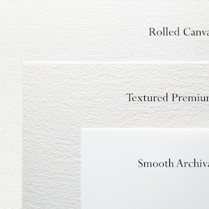 May include: A white image showcasing three different paper textures: Rolled Canvas, Textured Premium, and Smooth Archival. Each paper type is labeled with black text, highlighting the variety of surfaces available.