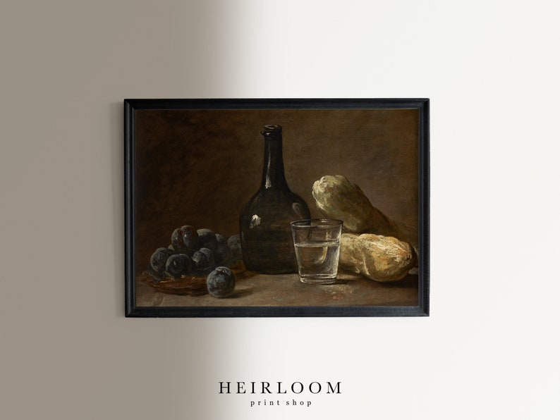May include: A framed still life print featuring a dark bottle, a glass of water, plums in a basket, and two gourds. The print has a vintage aesthetic with a dark, moody color palette. The text "HEIRLOOM print shop" is at the bottom.