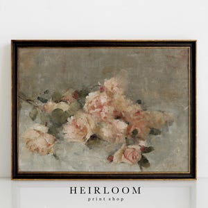 May include: An antique-style framed print featuring a still life of soft pink roses. The painting has a muted color palette with a focus on the delicate petals and leaves. The frame is dark brown with gold accents. The text "HEIRLOOM print shop" is at the bottom.