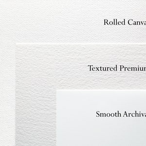 May include: Close-up of three different paper textures: Rolled Canvas, Textured Premium, and Smooth Archival.