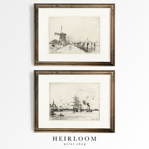 May include: Two framed black and white prints of vintage Dutch scenes. The top print shows a windmill and people walking on a path. The bottom print shows a ship docked in a harbor.