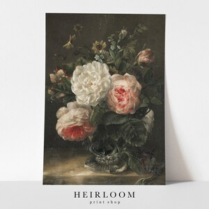 May include: A still life painting of a bouquet of white and pink roses in a clear glass vase. The flowers are arranged in a vase with a decorative base. The background is a dark brown.