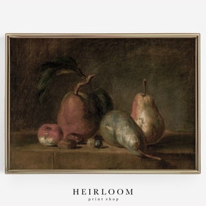 May include: A framed still life print featuring apples and pears in a classic style. The painting has a dark, moody color palette with a gold frame. The text "HEIRLOOM print shop" is at the bottom.