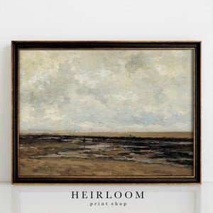 May include: A framed landscape painting with a dark brown frame. The artwork depicts a coastal scene with a cloudy sky, a sandy beach, and dark, possibly rocky, areas. The painting has a vintage aesthetic.