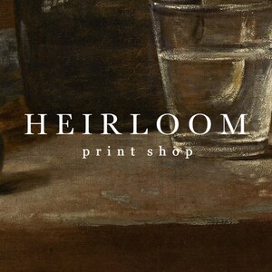 May include: Still life painting featuring a glass of water, plums, and a dark-colored container. The text "HEIRLOOM print shop" is displayed in white. The artwork has a vintage aesthetic with a focus on natural light and shadow.