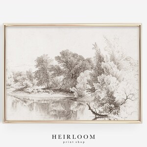 May include: A black and white pencil drawing of a landscape with trees and a river. The drawing is framed in a gold frame.