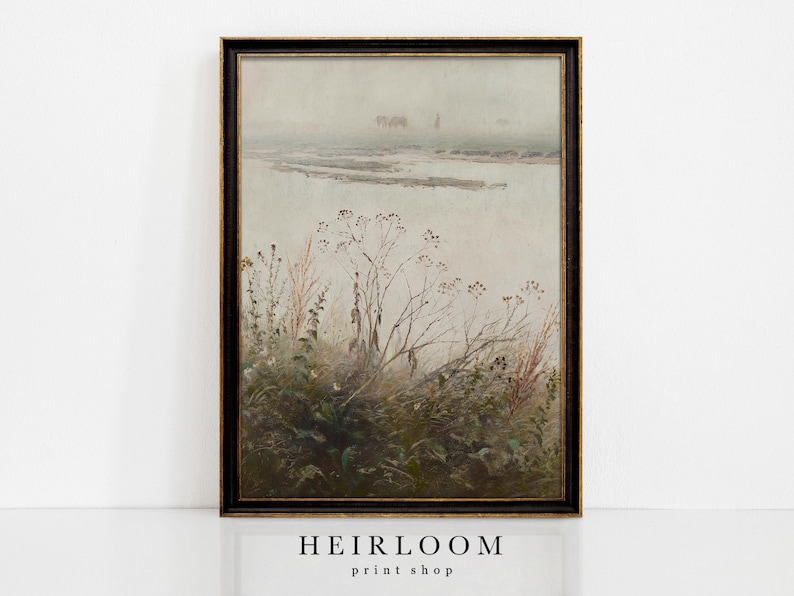May include: A framed vintage landscape print featuring a misty marsh scene with tall grasses and distant figures. The artwork has a muted color palette of greens, browns, and grays, with a black and gold frame. The text "HEIRLOOM print shop" is at the bottom.