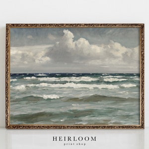 May include: A framed painting of a seascape with a blue and green ocean and white clouds in a light blue sky.
