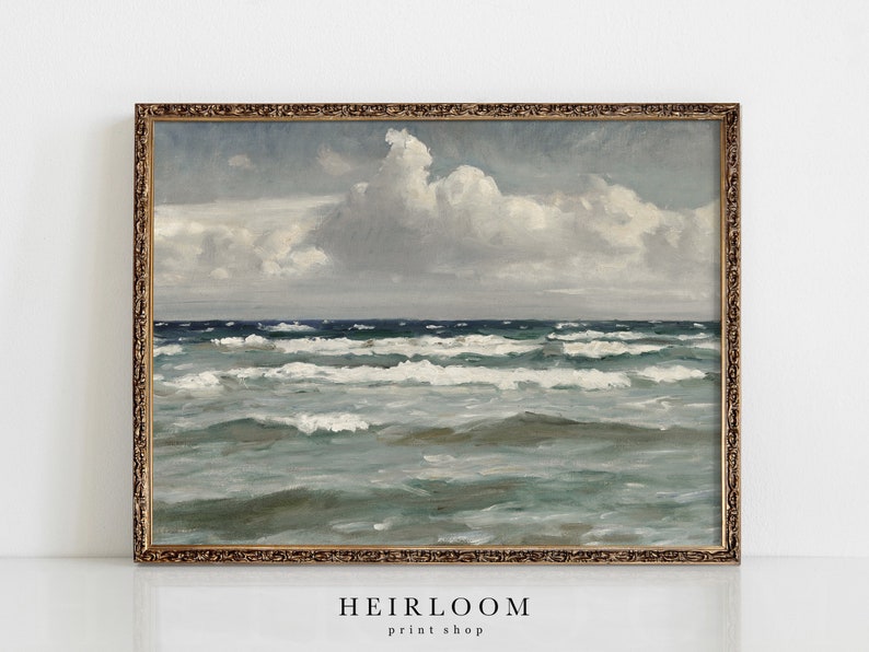 May include: A framed painting of a seascape with a blue and green ocean and white clouds in a light blue sky.