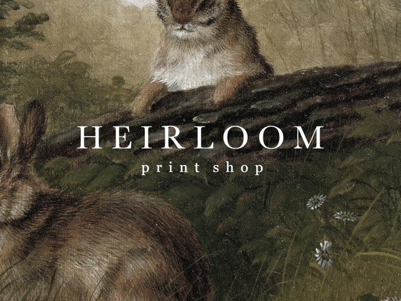 May include: An antique-style print featuring two rabbits in a natural setting. The image has a vintage aesthetic with soft colors and detailed fur textures. The text "HEIRLOOM print shop" is displayed in a classic font.