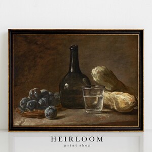 May include: A still life painting featuring a dark bottle, a glass of water, a cluster of grapes, and two gourds. The artwork has a vintage aesthetic with a dark color palette and is framed in a black and gold frame.