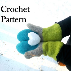 May include: A pair of crocheted mittens in teal, gray, and green, holding a small snowball shaped like a heart. Crochet Pattern.