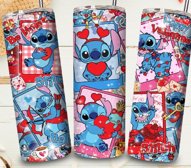 May include: Three stainless steel tumblers with a Valentine's Day theme. Each tumbler features a blue cartoon character holding a heart, with text that reads "Be Mine", "Stitch", and "Happy Valentine". The tumblers have a straw and a lid.
