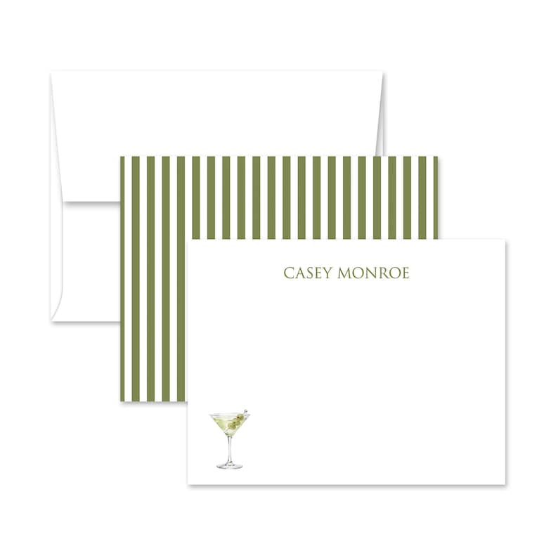 May include: White stationery set featuring a martini illustration and the name "CASEY MONROE" in a serif font. The set includes a white envelope, a card with olive green stripes, and a white card with a martini glass.