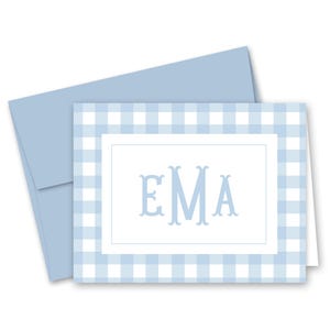 May include: A light blue gingham patterned stationery set with a matching envelope. The card features the monogram "EMA" in a light blue color, centered within a white border.