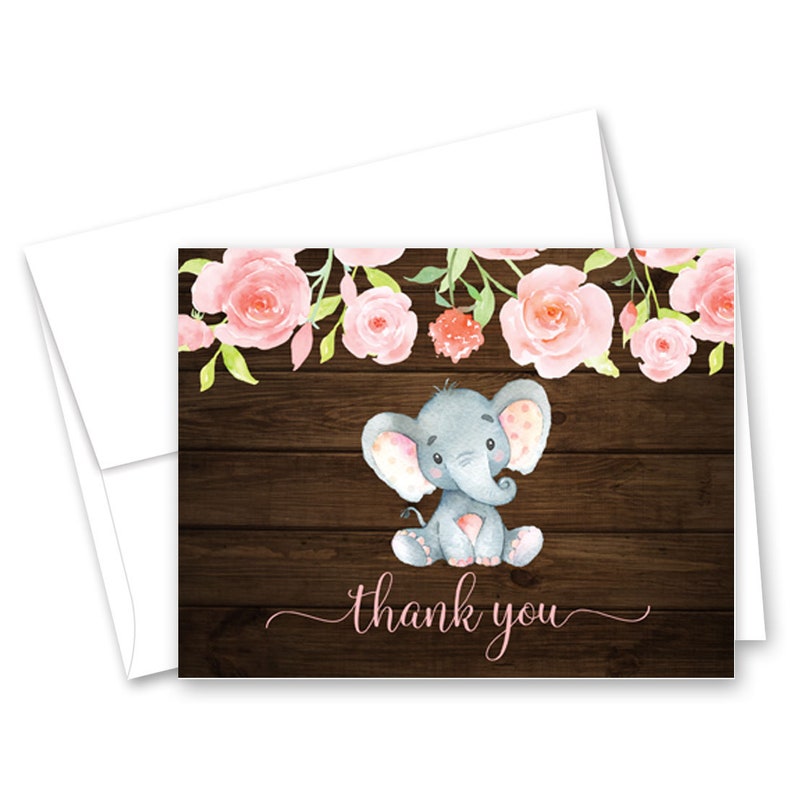 May include: A thank you card with a watercolor illustration of a gray elephant with pink accents sitting on a brown wood background. Pink flowers with green leaves are above the elephant. The text "thank you" is written in pink cursive.