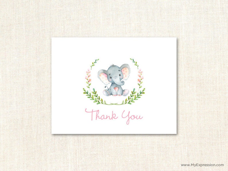 May include: A thank you card with a watercolor illustration of a gray elephant with pink accents sitting in a wreath of green leaves and pink flowers. The text "Thank You" is written in pink below the elephant.