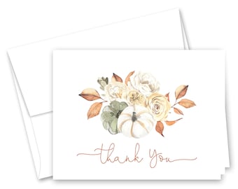 May include: White thank you cards with a watercolor design of pumpkins, roses, and leaves in shades of white, green, and orange. The words "thank you" are written in a delicate, cursive font. Includes a white envelope.