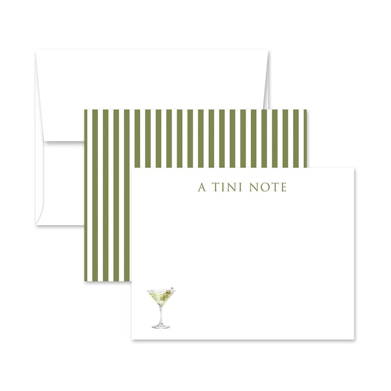 May include: Stationery set featuring a white envelope, a notepad with olive green striped accents, and a notepad with a martini illustration. The notepad reads "A TINI NOTE". The martini has an olive garnish.