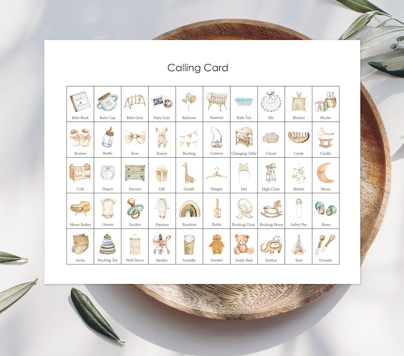 May include: A printable calling card with illustrations of baby items. The card features a grid of 36 squares, each containing a different baby item, such as a baby book, a baby bottle, a crib, a diaper, a giraffe, a rattle, a rocking horse, a teddy bear, and a teether. The card is designed in a neutral color palette of beige, brown, and white.