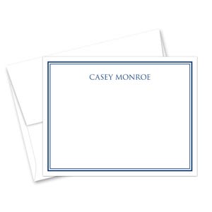 May include: White stationery set featuring a rectangular card with a navy blue border and the name "CASEY MONROE" printed in navy blue. An envelope is visible behind the card.