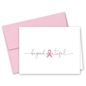 May include: A white card with a pink ribbon and the text "beyond grateful" in black cursive script.
