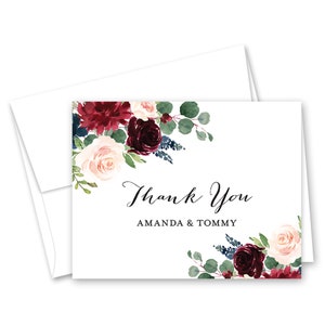 May include: Thank You card with a floral design featuring burgundy, blush pink, and green flowers. The text "Thank You Amanda & Tommy" is printed on the card.