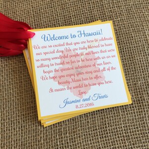 May include: A yellow and orange card with a floral design and the text "Welcome to Hawaii!"  We are so excited that you are here to celebrate our special day. We are truly blessed to have so many wonderful people in our lives that were willing to travel so far to be here with us as we begin the greatest adventure of our lives. We hope you enjoy your stay and all of the beauty Maui has to offer. It means the world to have you here. Love. Jasmine and Travis 8.27.2016