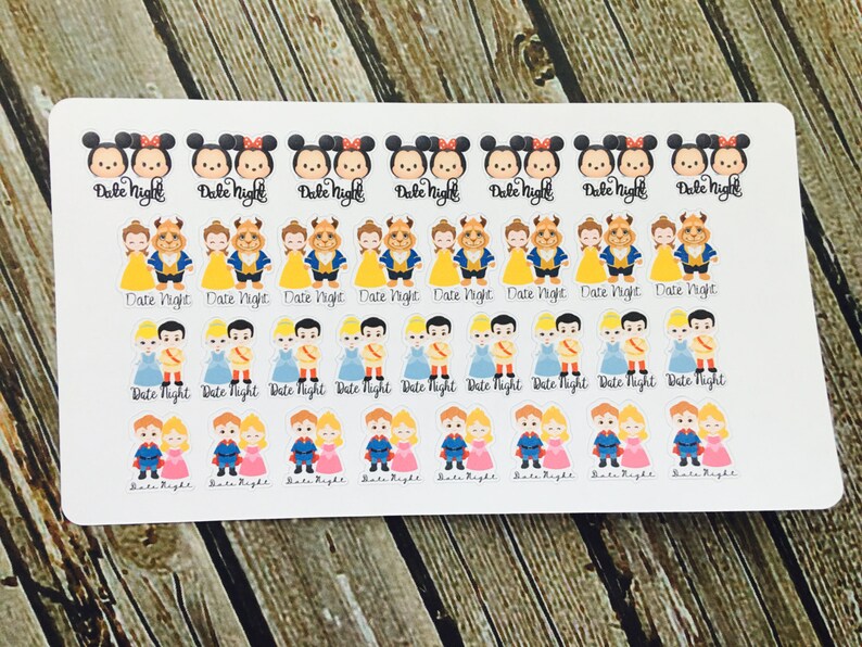 May include: A sheet of stickers featuring various Disney couples, including Mickey and Minnie Mouse, Belle and the Beast, and Cinderella and Prince Charming. Each sticker has the text "Date Night" printed below the couple.