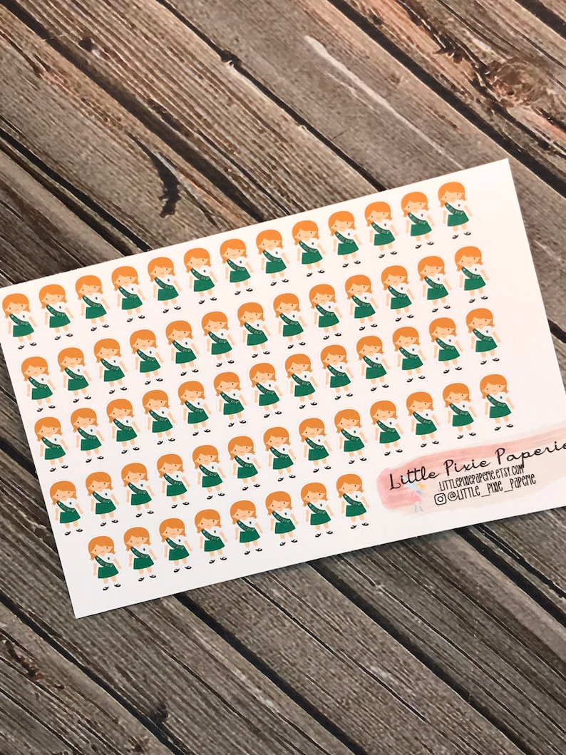 May include: A sheet of stickers featuring a repeated pattern of a girl scout in a green uniform and a white shirt. The girl scout has red hair and is smiling. The stickers are on a white background. The text "Little Pixie Paperie" is in the bottom right corner of the sheet.