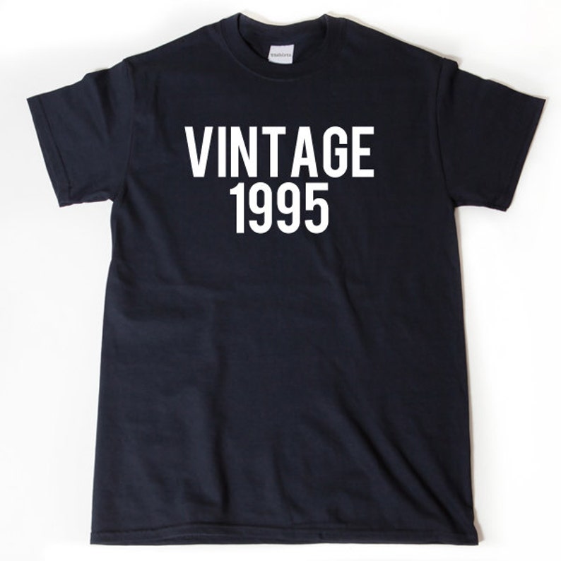 May include: A black t-shirt with white text that reads "Vintage 1995".