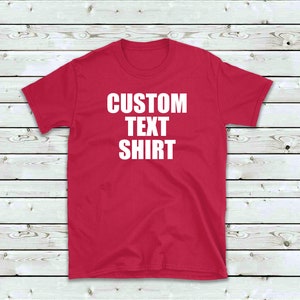 May include: A red t-shirt with the text "CUSTOM TEXT SHIRT" printed in white on the front.