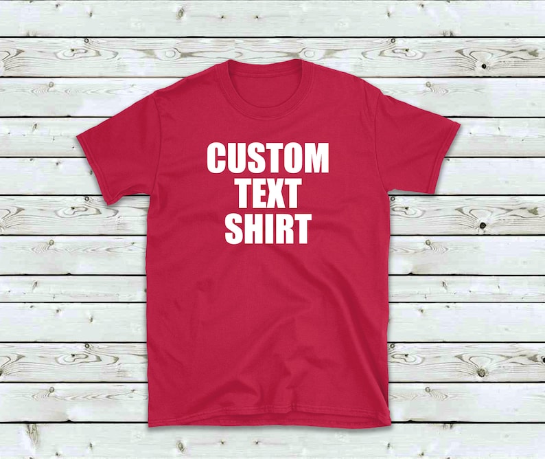 May include: A red t-shirt with the text "CUSTOM TEXT SHIRT" printed in white on the front.