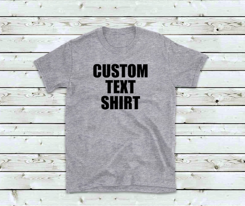 May include: A gray t-shirt with the text "CUSTOM TEXT SHIRT" printed in black.