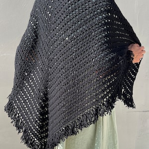 Beautiful crocheted shawl with long fringe