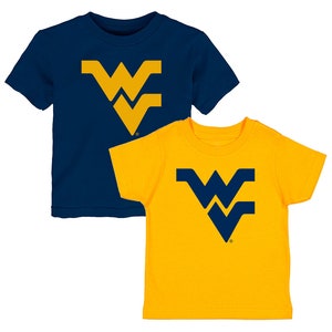 May include: Two toddler-sized t-shirts, one navy blue and one yellow, both featuring the West Virginia University Mountaineers logo in the opposite color.