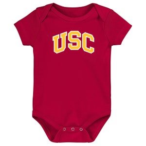 May include: Red baby onesie with the letters USC in yellow.