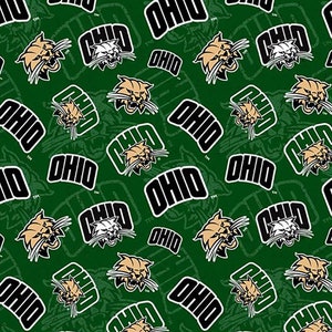 May include: A repeating pattern on a green background features the word "OHIO" in white block letters with a black outline. The pattern also includes the Ohio University Bobcats logo in gold and white.