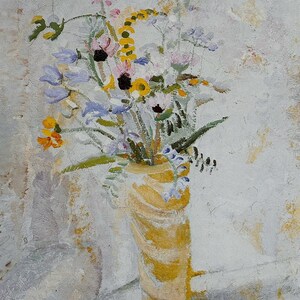 May include: An original painting of a floral still life. A yellow vase with vertical stripes holds a bouquet of colorful wildflowers, including pink, yellow, and blue blooms. The artwork is framed with a white mat.