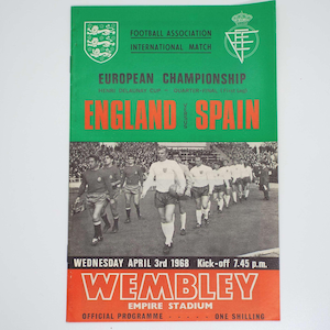 May include: A vintage football match program for the 1968 European Championship quarter-final between England and Spain at Wembley Empire Stadium. The cover features a green and orange design with a black and white photograph of soccer players.