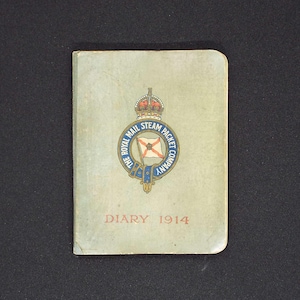 May include: A green diary with the text "DIARY 1914" and a circular logo featuring a crown, a flag, and the text "THE ROYAL MAIL STEAM PACKET COMPANY".