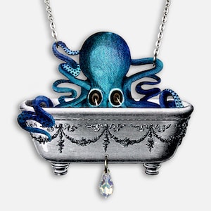 May include: A blue octopus in a silver bathtub with a crystal pendant hanging from the bottom. The octopus has its tentacles curled around the edge of the bathtub. The bathtub has a decorative design around the rim.