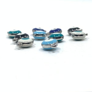 Thickness of Puffy double sided evil eye charms shown