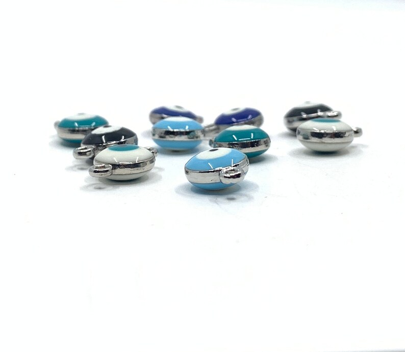 Thickness of Puffy double sided evil eye charms shown