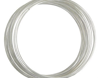 May include: A coil of silver wire, perfect for jewelry making or crafting projects.