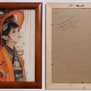 a framed artwork depicting a woman with an orange and black headdress, surrounded by an abstract, colorful design.